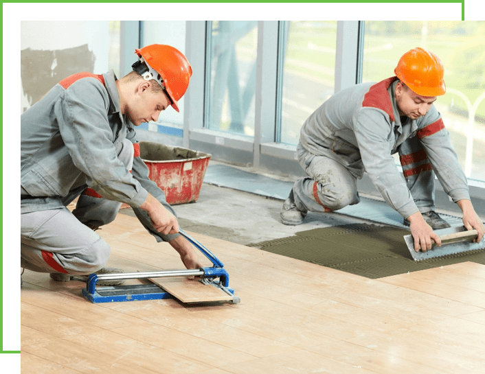 Two workers doing the plywood flooring